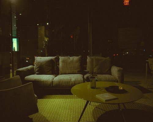 A relaxed evening setting with soft lighting and comfortable pillows