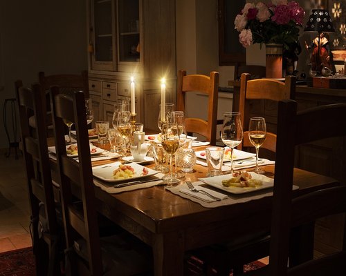 Family gathered around a dining table, sharing a peaceful meal